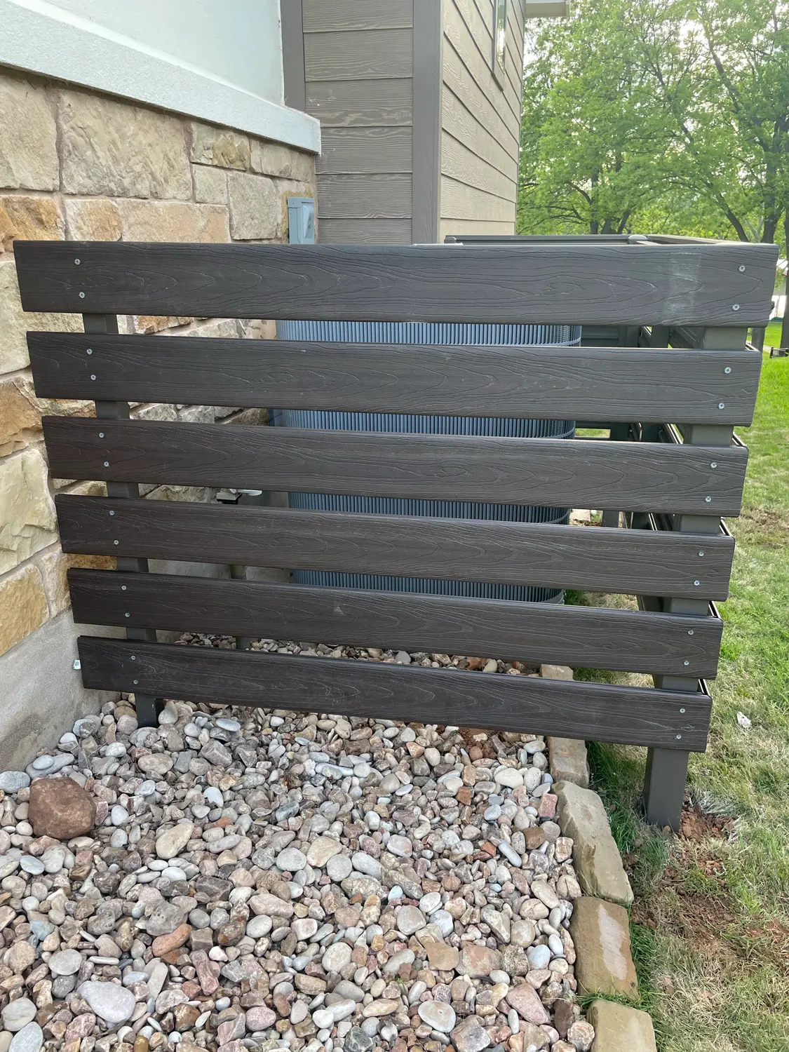Custom welded fence enclosure shielding an HVAC unit, by VP Welding in Burnet TX