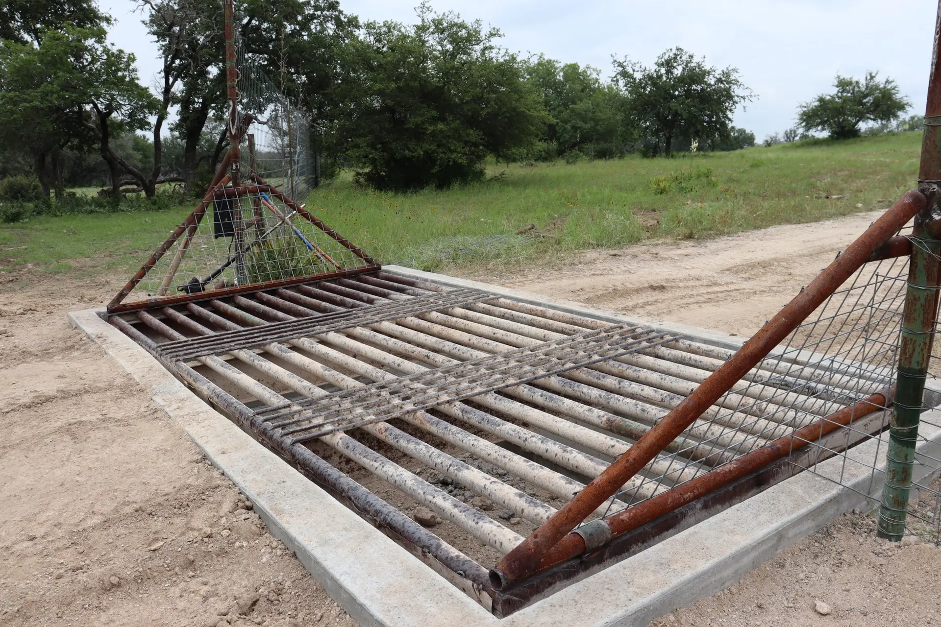 VP Welding cattle guard installed across a Hill Country ranch entrance road