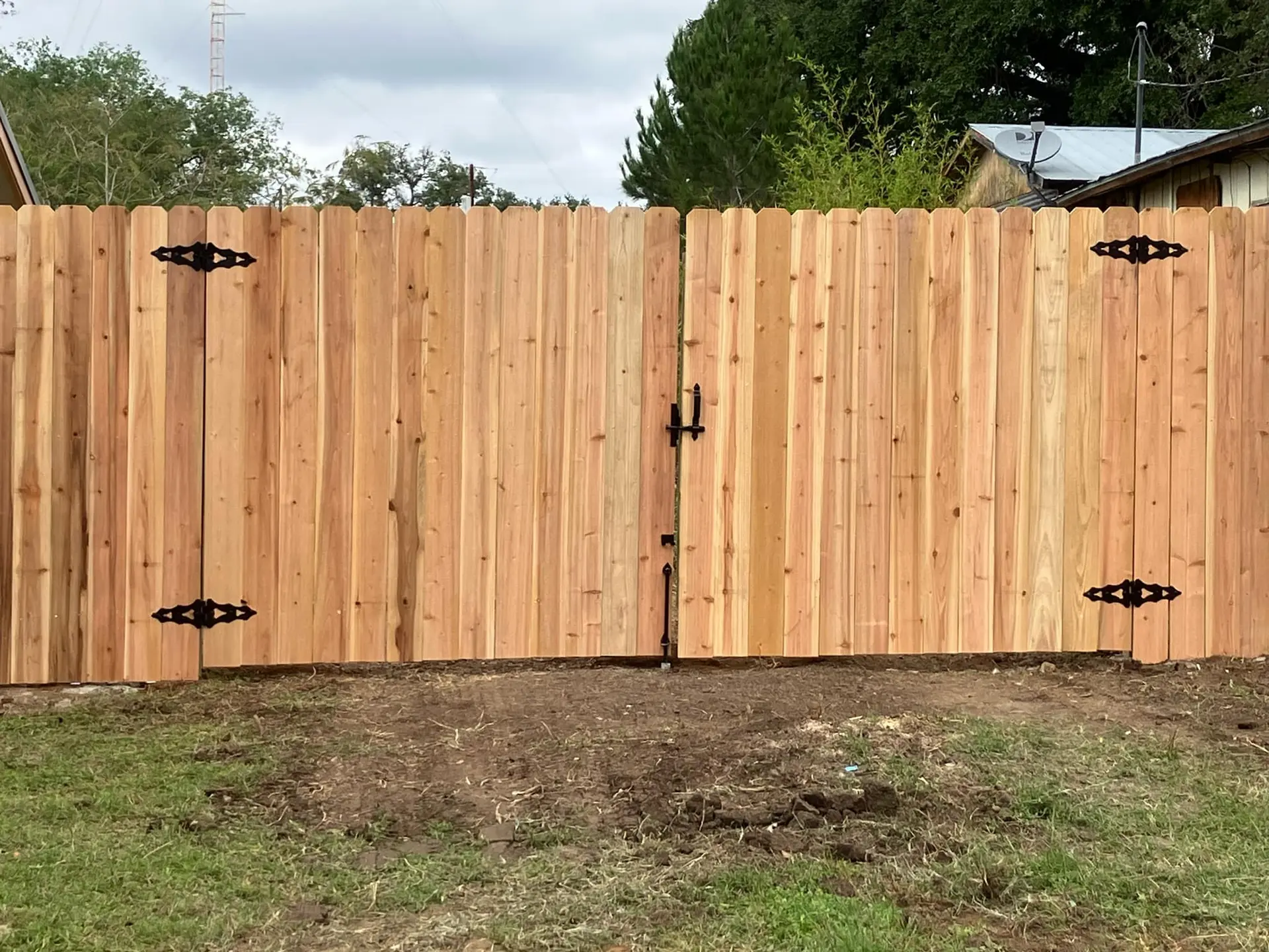 Cedar wood double gate fence installation by VP Welding in Burnet TX