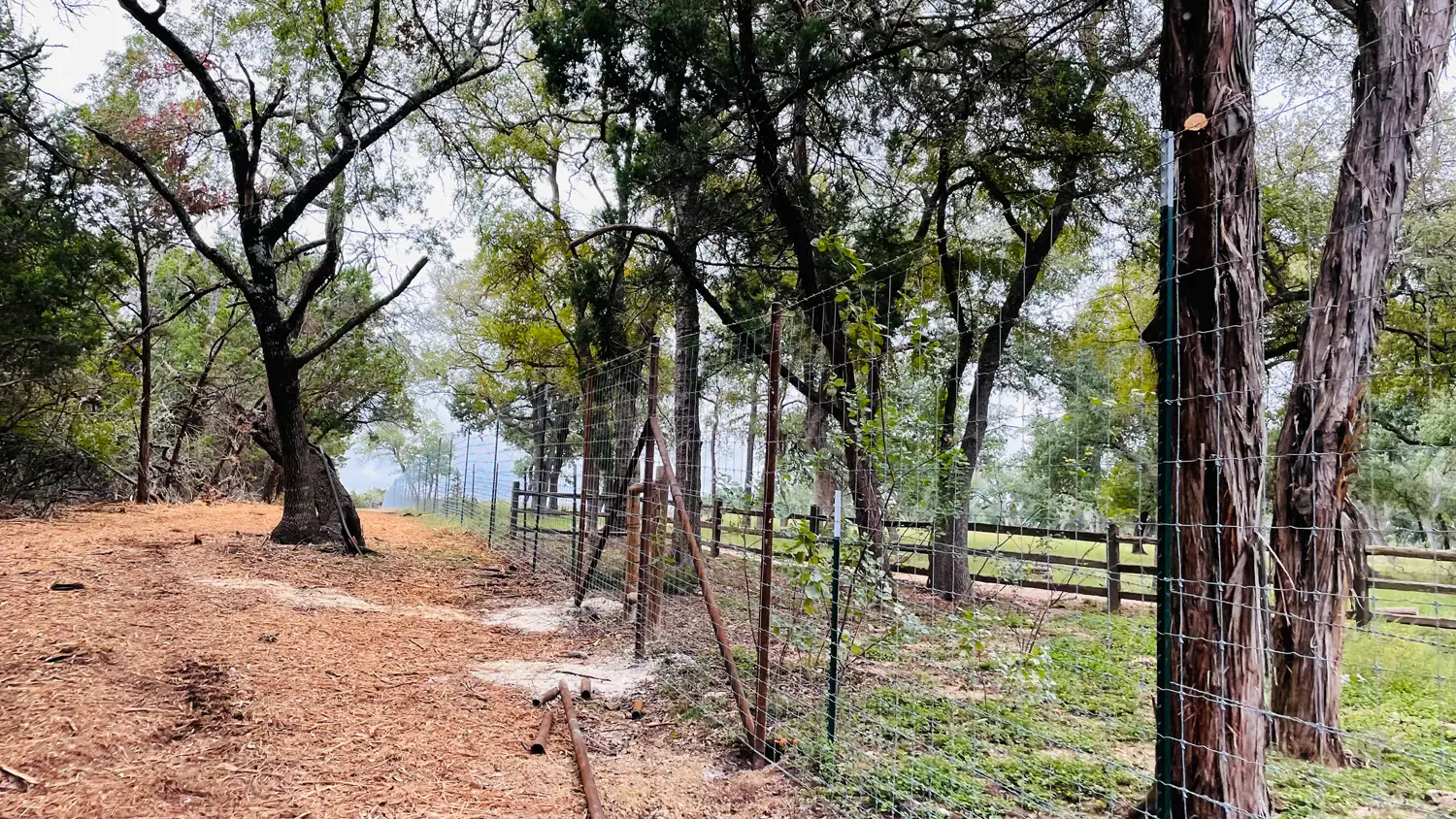Wire fencing installation across a Hill Country property by VP Welding in Burnet TX